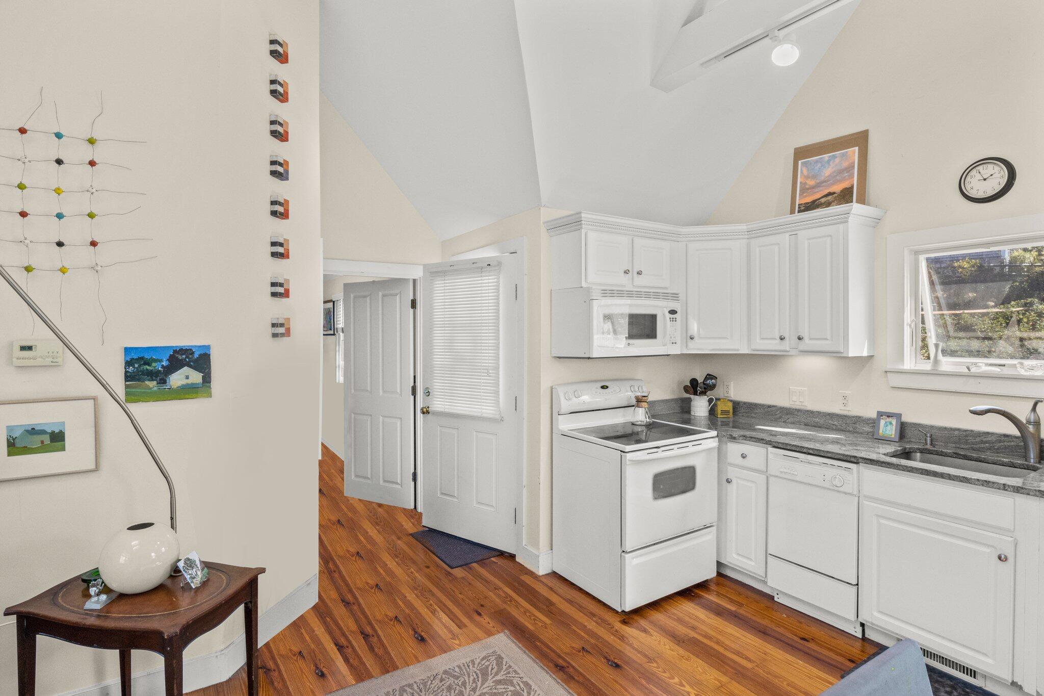 6 Shore Road, Unit 16 Truro, MA 02666 - Photo 3 of 21 a kitchen with stainless steel appliances a stove a sink and a refrigerator