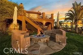 a view of a water fountain in front of a house