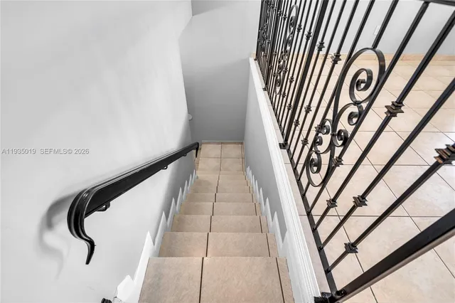 a bathroom with a toilet a sink and a mirror