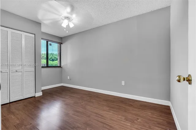 a view of room with wooden floor