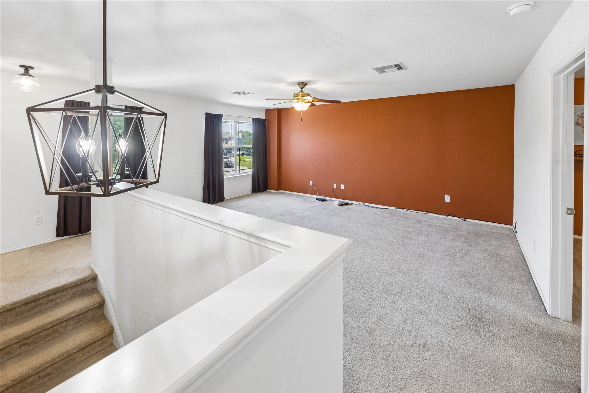 338 Spring Branch Loop Kyle, TX 78640 - Photo 14 of 36 A versatile open space with soft carpeting awaits your personal touch.