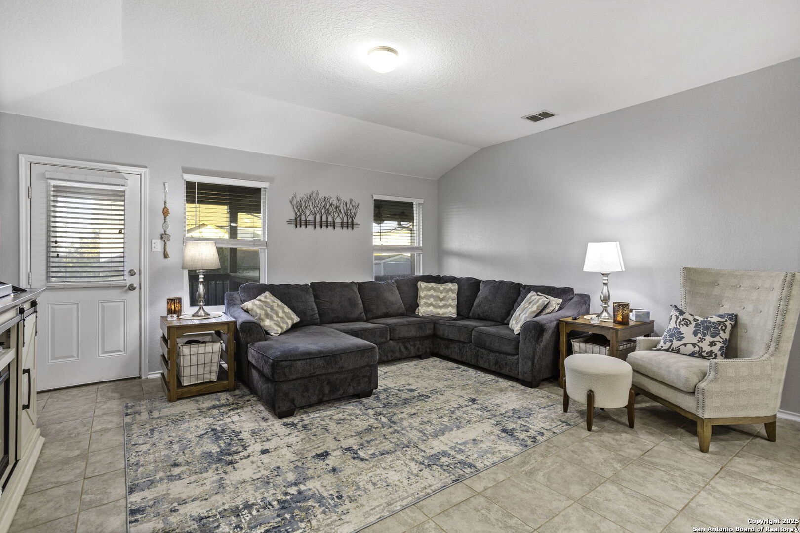 212 Kildeer Creek San Antonio, TX 78253 - Photo 11 of 29 a living room with furniture a lamp and a window