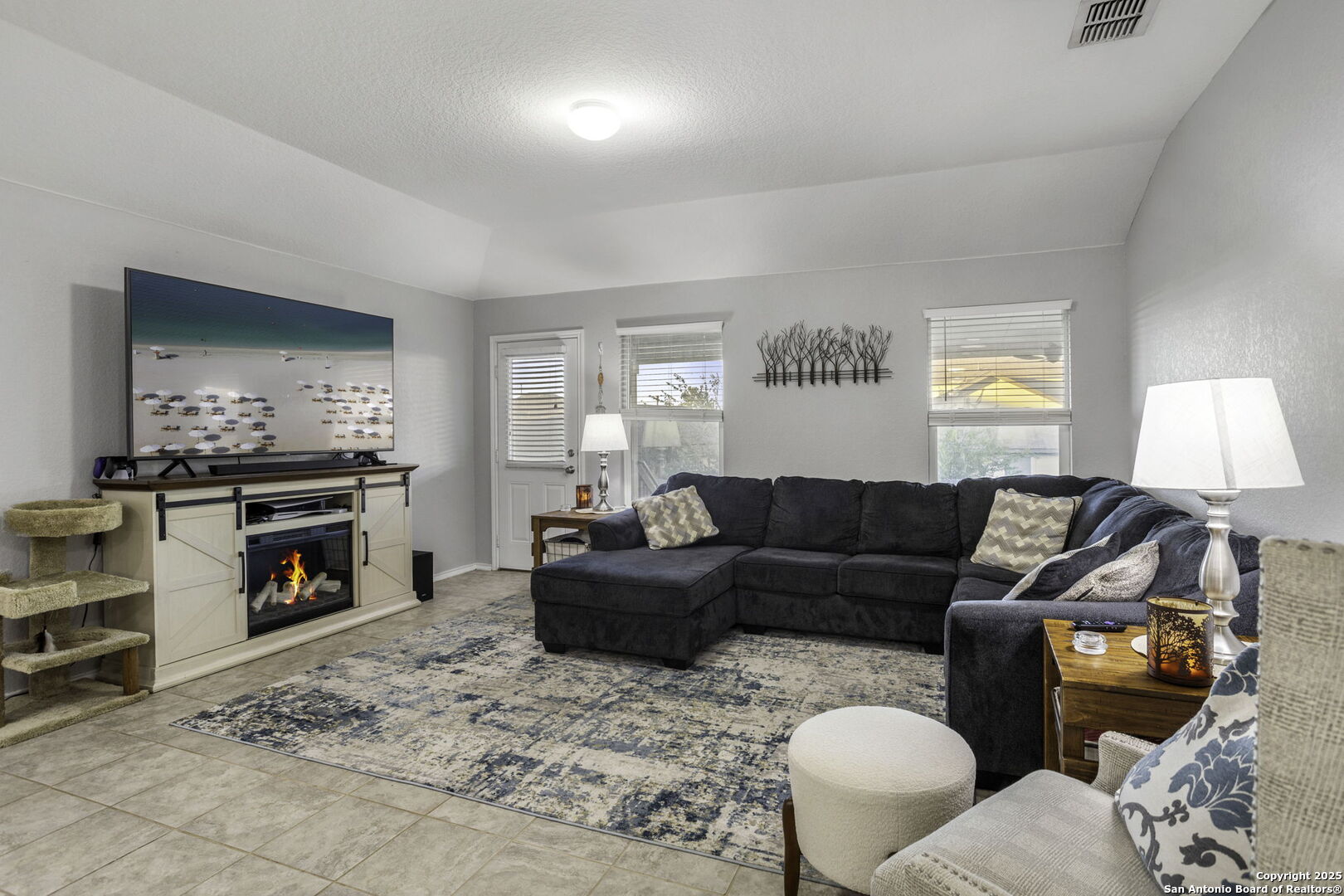 212 Kildeer Creek San Antonio, TX 78253 - Photo 12 of 29 a living room with furniture and a flat screen tv