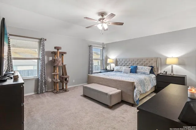 a bedroom with bed and a chandelier