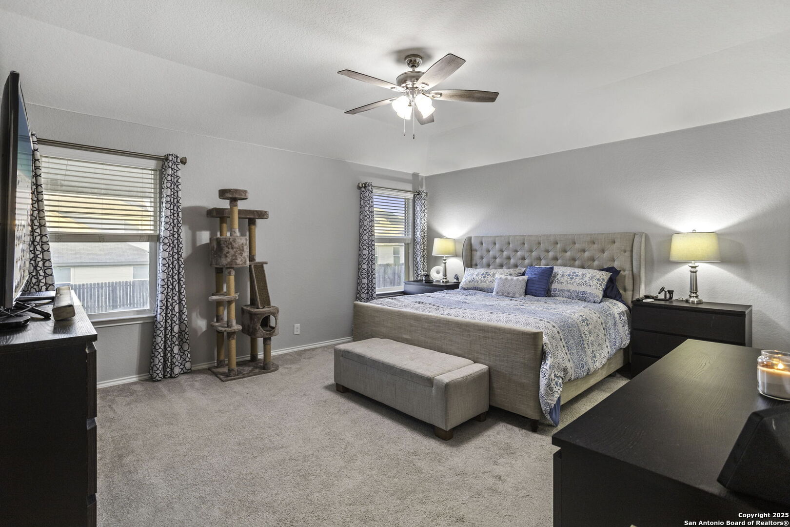 212 Kildeer Creek San Antonio, TX 78253 - Photo 13 of 29 a bedroom with bed and a chandelier