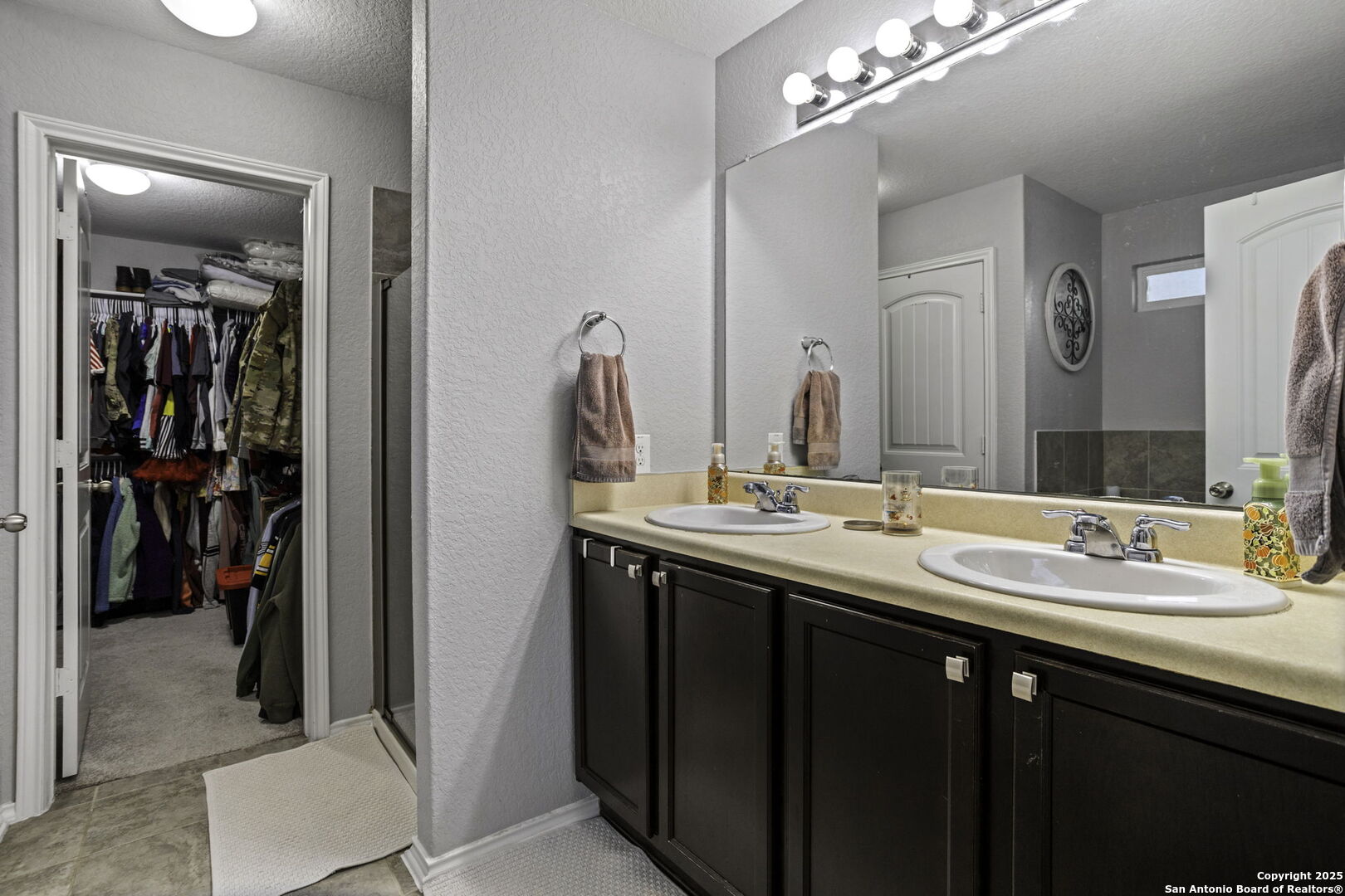 212 Kildeer Creek San Antonio, TX 78253 - Photo 14 of 29 a en suite bathroom with a double vanity sink and a mirror