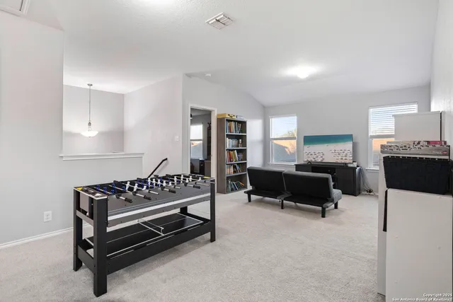 a bedroom with furniture and a rug