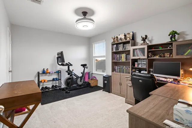 a view of a workspace with furniture