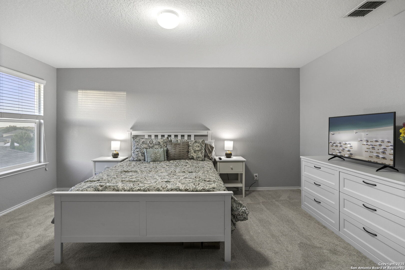 212 Kildeer Creek San Antonio, TX 78253 - Photo 21 of 29 a bed sitting in a bedroom and window