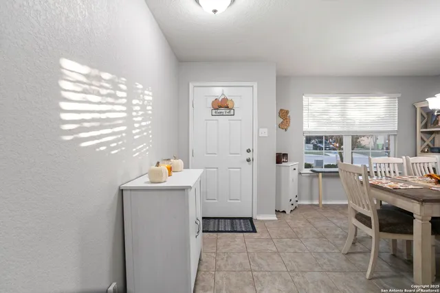 a room that has a lot of furniture and a window in it