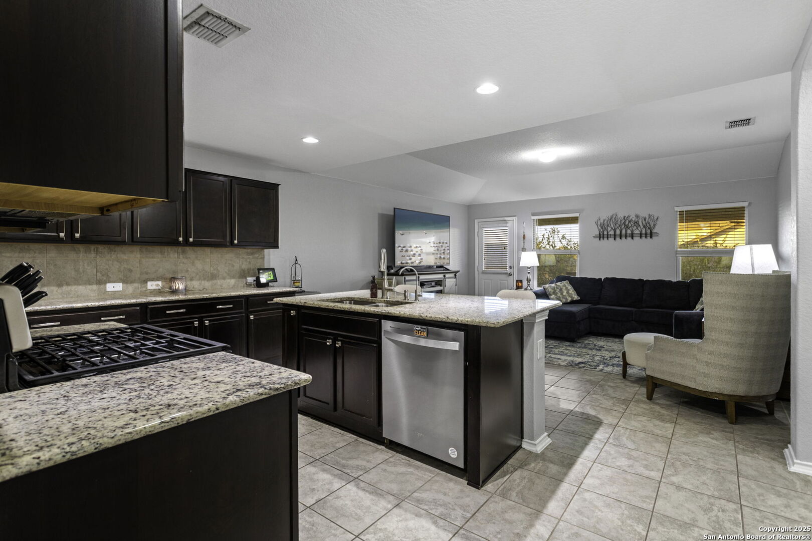 212 Kildeer Creek San Antonio, TX 78253 - Photo 7 of 29 a kitchen with stainless steel appliances granite countertop a sink a stove a counter space and cabinets