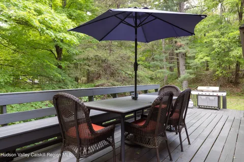 a view of an outdoor sitting area with furniture