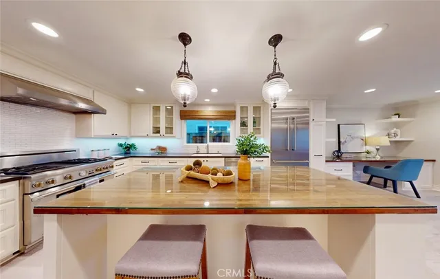 a kitchen with sink and stove