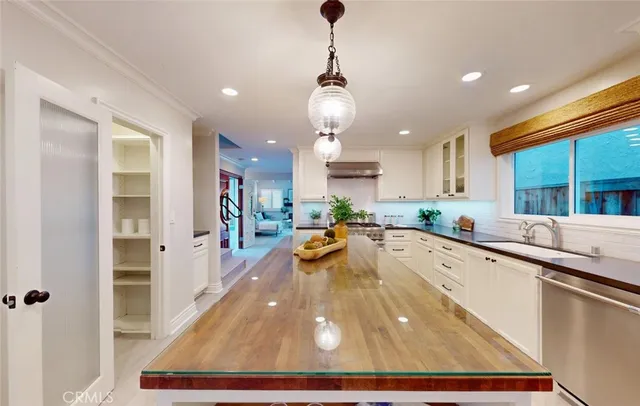 a dining room with furniture and a view of kitchen