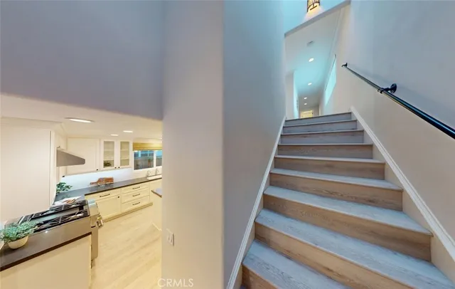 a bedroom with a bed and a potted plant