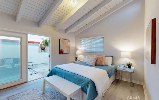 a kitchen with a white cabinets and chairs