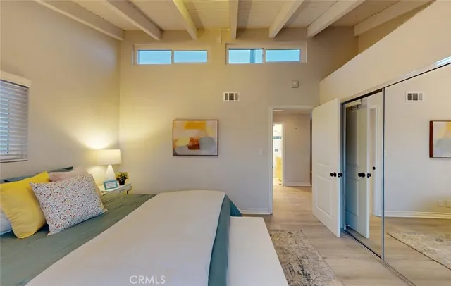 a bedroom with a large bed and a couch