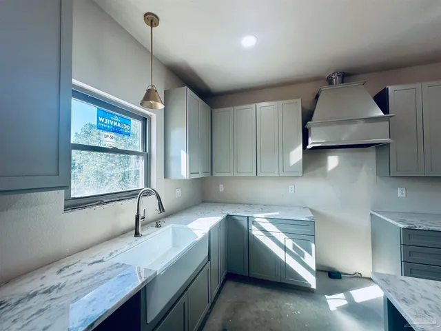 a view of a swimming pool with an outdoor space and seating area