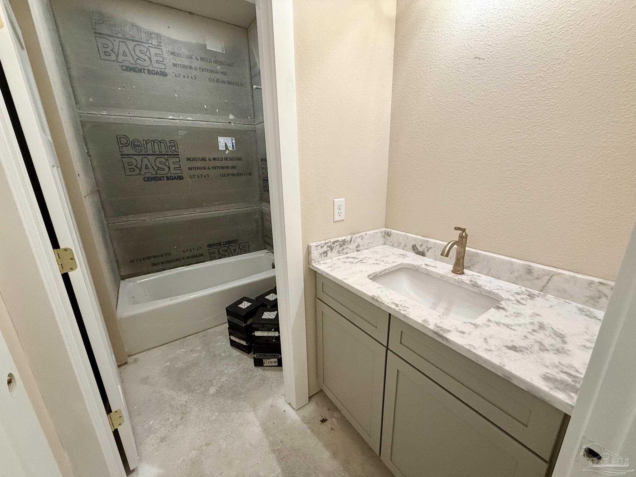 5009 Timber Ridge Drive Pace, FL 32571 - Photo 39 of 72 a bathroom with a granite countertop sink and a mirror