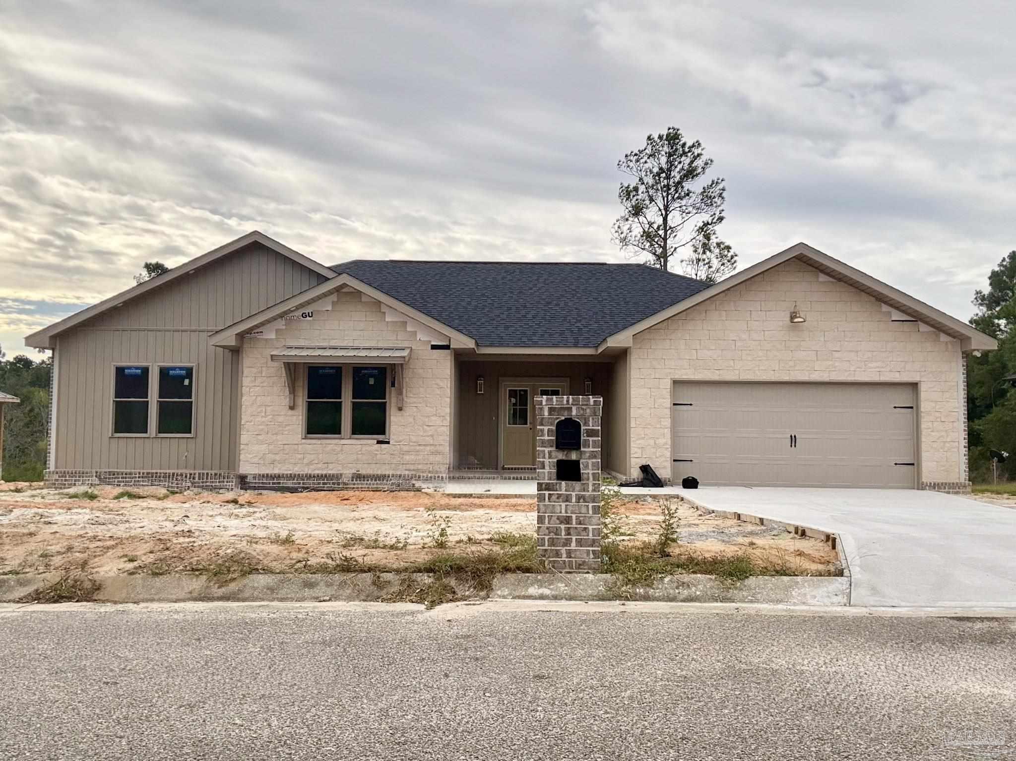 5009 Timber Ridge Drive Pace, FL 32571 - Photo 4 of 72 a view of a house with a yard