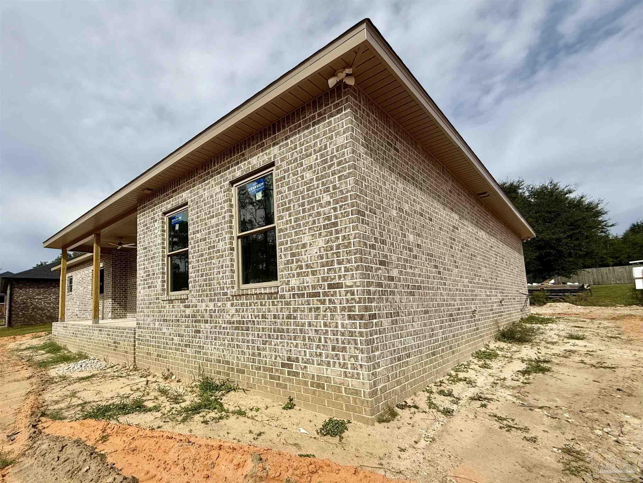 5009 Timber Ridge Drive Pace, FL 32571 - Photo 52 of 72 a front view of a house with a yard