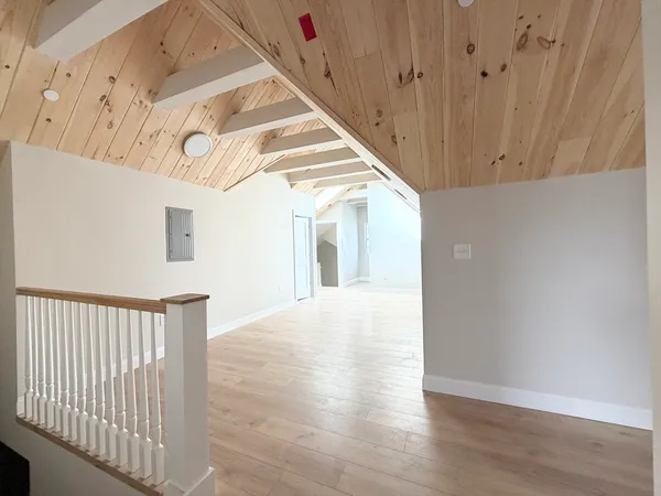 a view of a hallway view with staircase