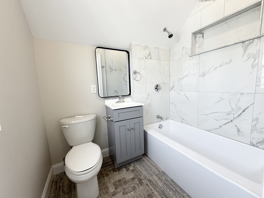 3 1/2 Buffum Street, Unit 3 Salem, MA 01970 - Photo 3 of 10 a bathroom with a toilet sink and bathtub