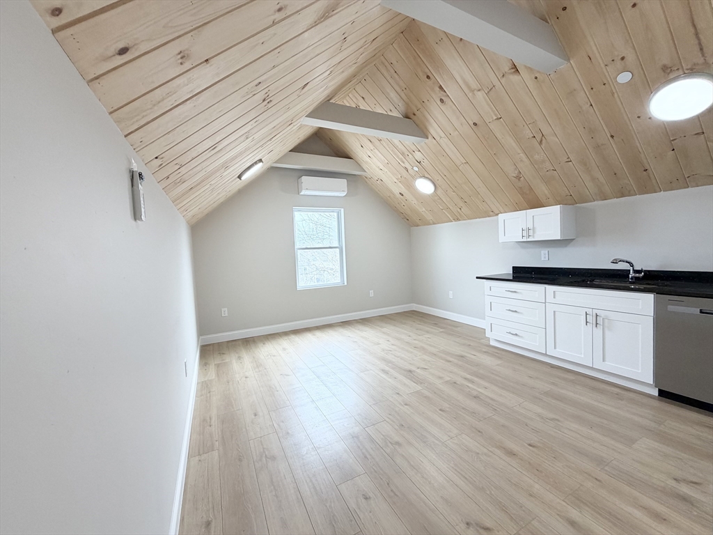 3 1/2 Buffum Street, Unit 3 Salem, MA 01970 - Photo 10 of 10 a view of a kitchen with a sink and wooden floor