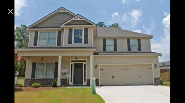 a view of a brick house with a large windows