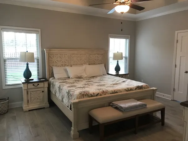 a bedroom with a bed and window