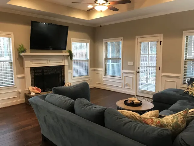 a living room with furniture and a fireplace