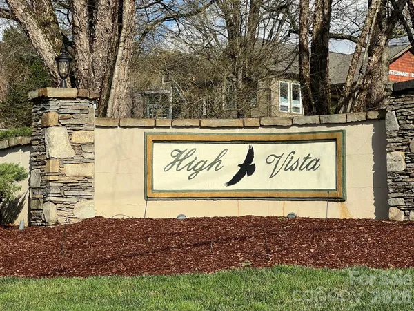 a view of outdoor space with signage and flags