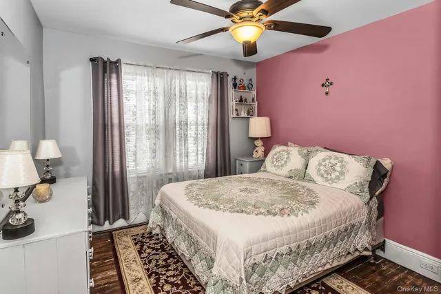 a bathroom with a granite countertop sink a mirror and shower