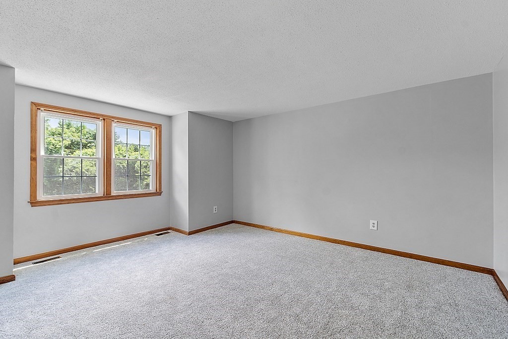 25 Juniper Place, Unit 9 Lowell, MA 01852 - Photo 15 of 42 a view of an empty room with a window