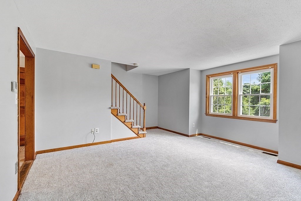 25 Juniper Place, Unit 9 Lowell, MA 01852 - Photo 16 of 42 an empty room with windows