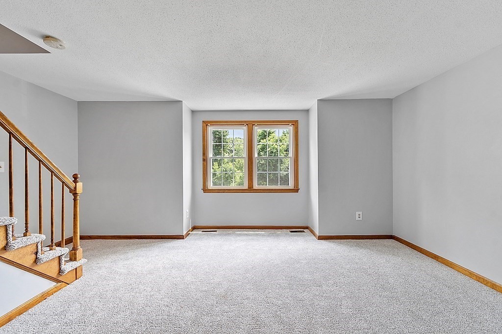 25 Juniper Place, Unit 9 Lowell, MA 01852 - Photo 17 of 42 an empty room with windows
