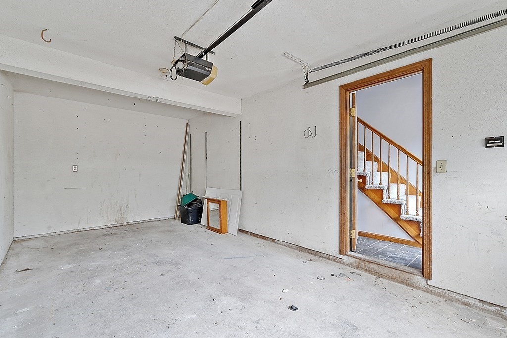 25 Juniper Place, Unit 9 Lowell, MA 01852 - Photo 30 of 42 a view of empty room with wooden floor