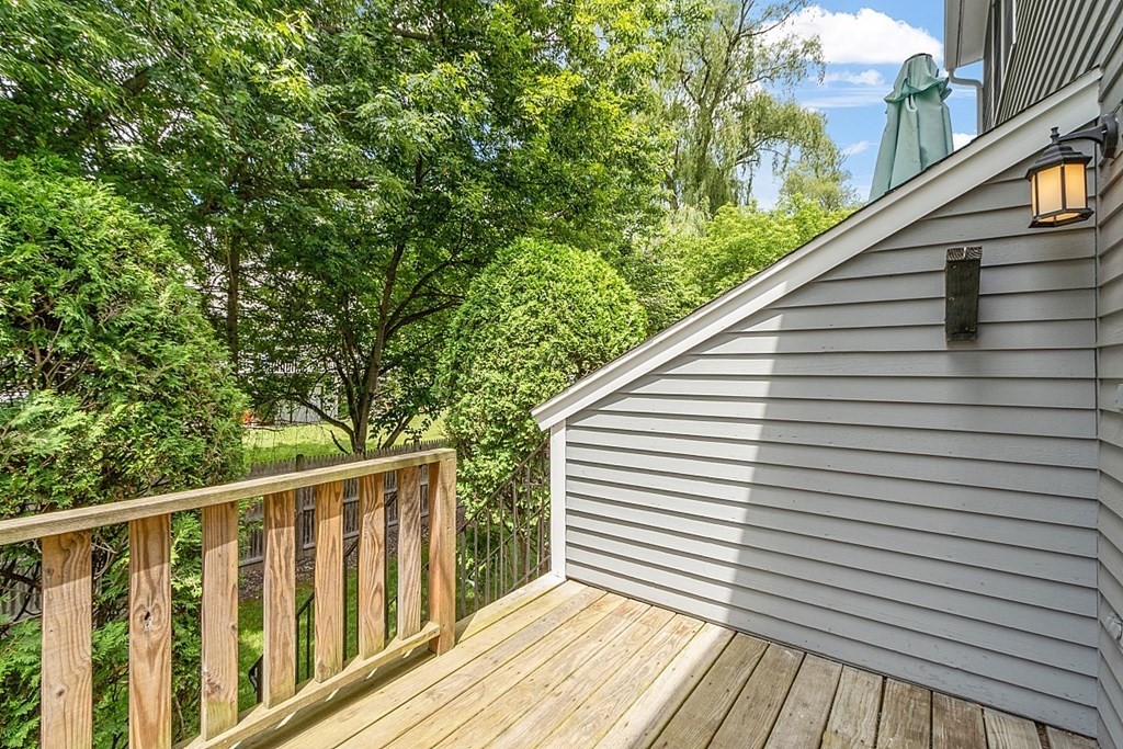 25 Juniper Place, Unit 9 Lowell, MA 01852 - Photo 33 of 42 a view of a balcony with wooden floor