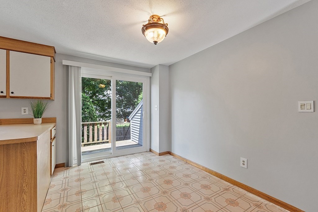 25 Juniper Place, Unit 9 Lowell, MA 01852 - Photo 4 of 42 a view of an empty room with a window