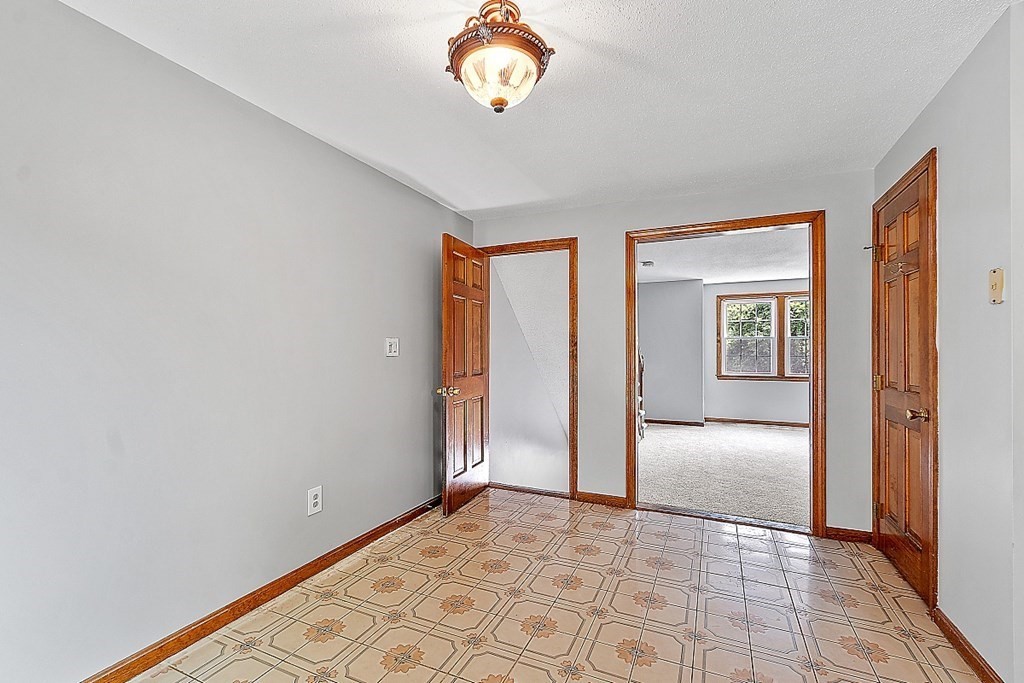 25 Juniper Place, Unit 9 Lowell, MA 01852 - Photo 5 of 42 a view of an entryway with wooden floor
