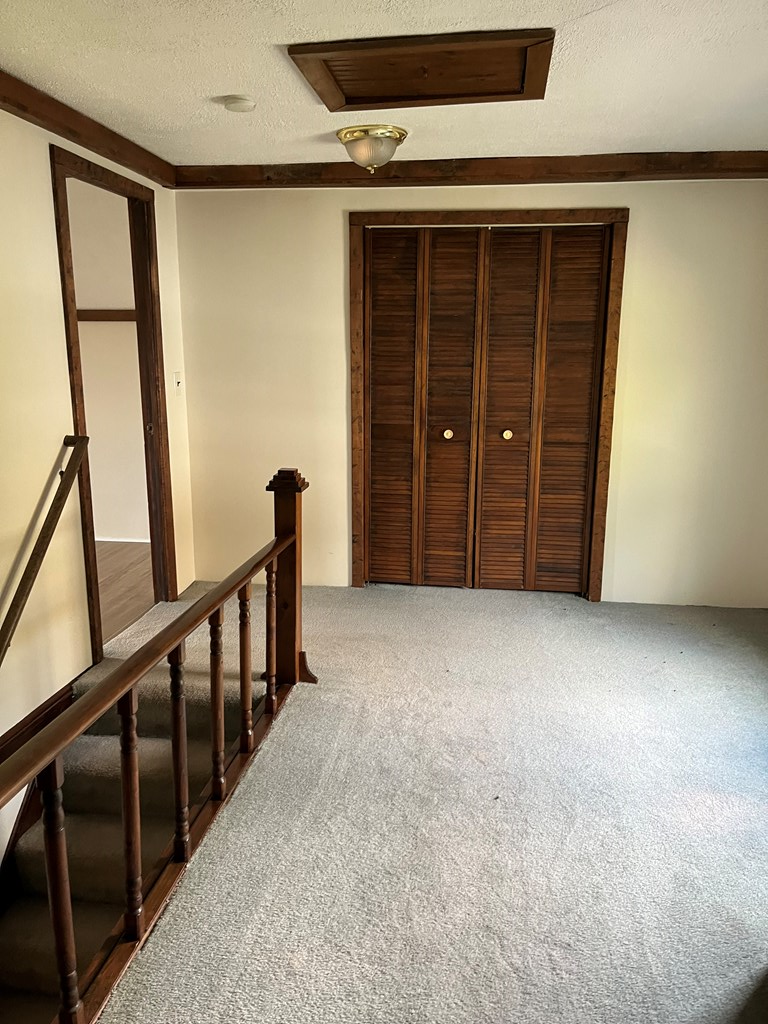 12391 Jackson Run Road Sugar Grove, PA 16350 - Photo 19 of 40 a view of an empty room with wooden door