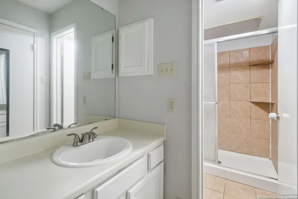 a bathroom with a sink and a mirror