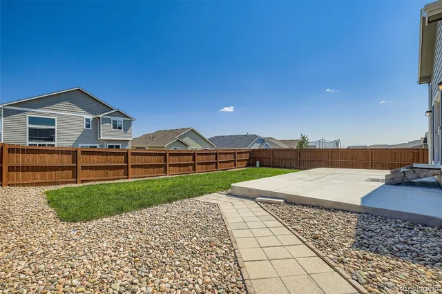a view of a backyard of the house