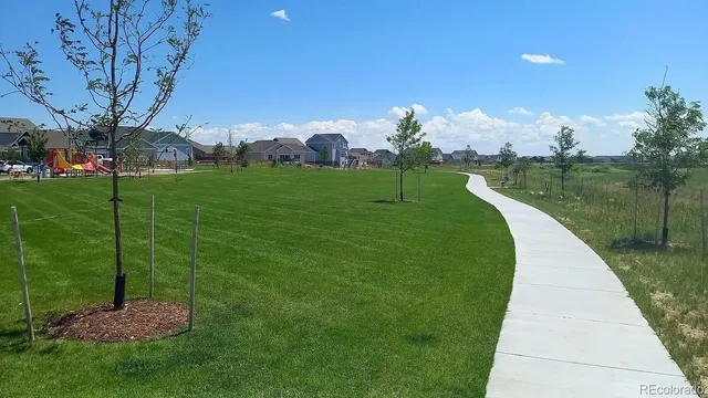 a view of a building with a big yard