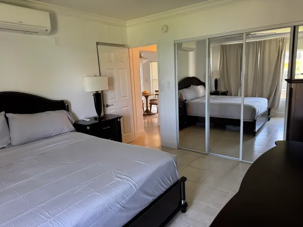 a bedroom with a bed and a dresser