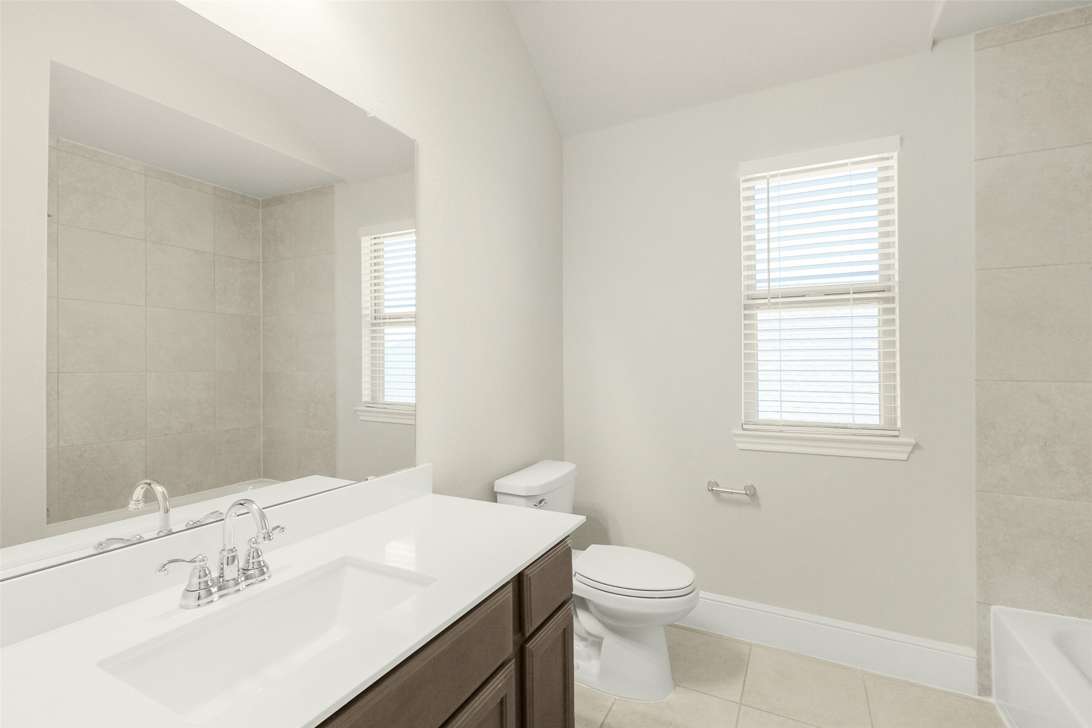10514 Rigel Rdg Way Richmond, TX 77406 - Photo 43 of 50 Conveniently located just outside the bedroom, this full bath serves both the secondary bedroom and game room and features a tub/shower combination and quartz countertop.