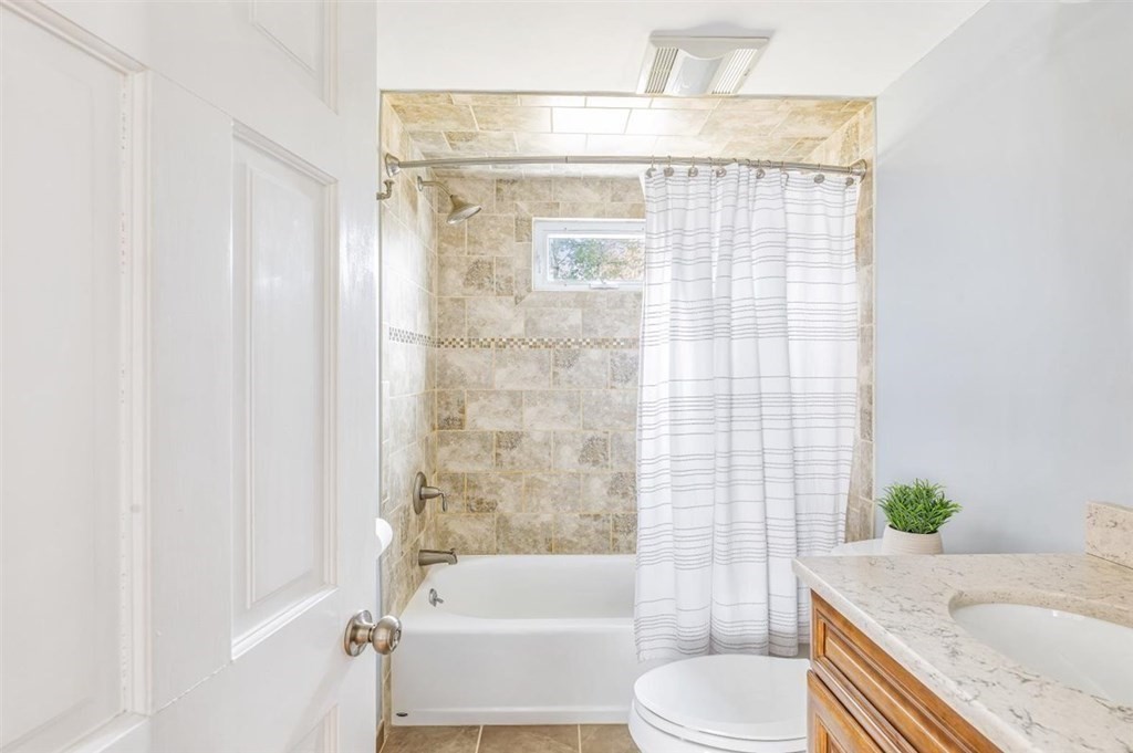 31 Gerard Road Norwell, MA 02061 - Photo 12 of 30 a bathroom with a granite countertop bathtub sink vanity mirror and toilet