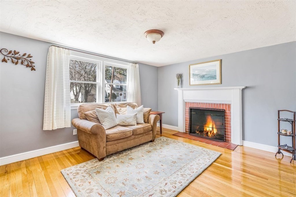 31 Gerard Road Norwell, MA 02061 - Photo 15 of 30 a living room with furniture and a fireplace