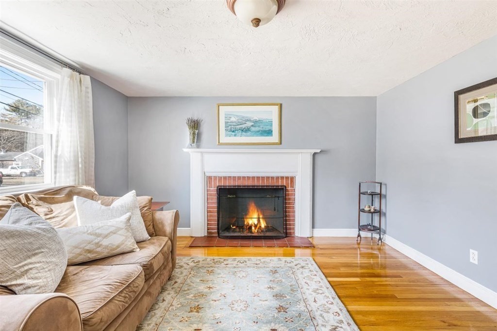 31 Gerard Road Norwell, MA 02061 - Photo 16 of 30 a living room with furniture and a fireplace