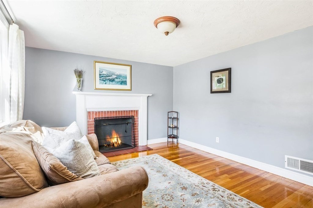 31 Gerard Road Norwell, MA 02061 - Photo 17 of 30 a living room with furniture and a fireplace